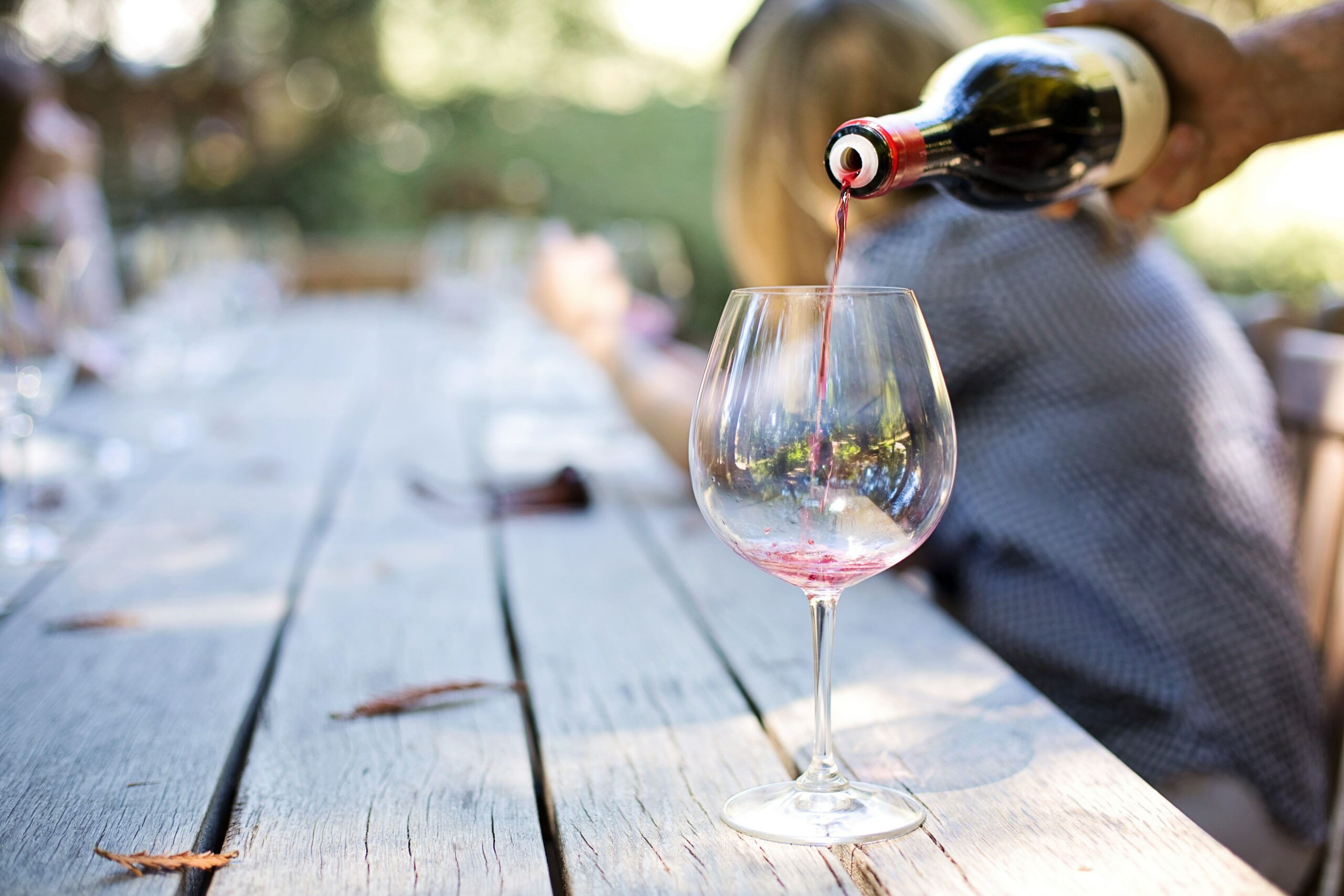 Man pouring wine (Photo courtesy of Pexels.com)