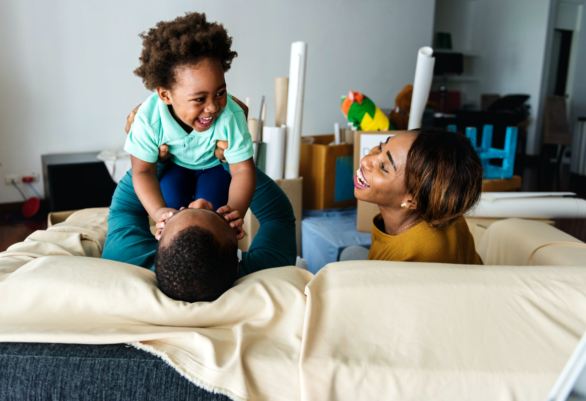 Family moving into new home (Photo courtesy of rawpixel.com)