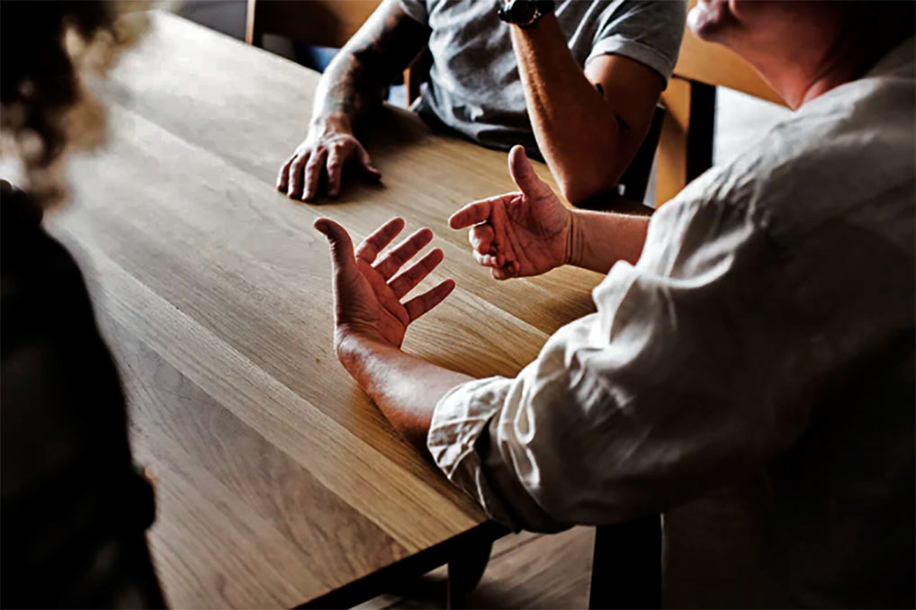People talking (Courtesy of rawpixel.com)