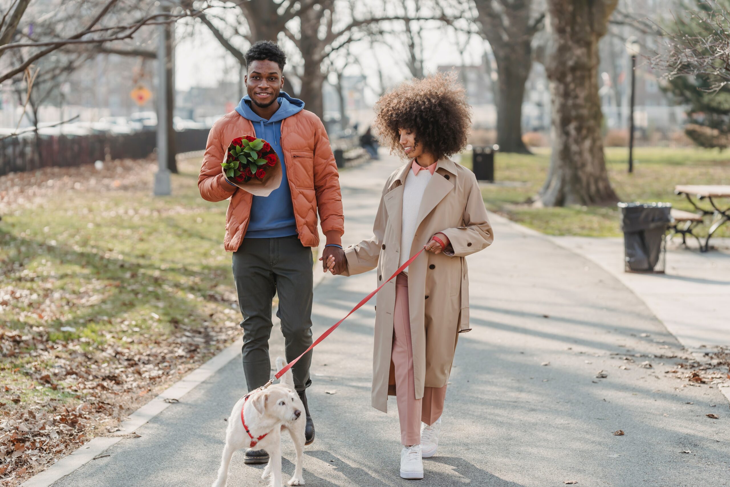 Couple walking with dog
