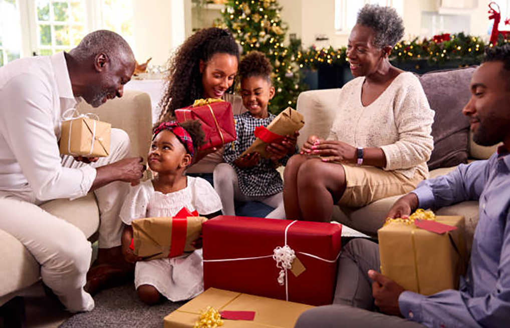 family during christmas opening gifts